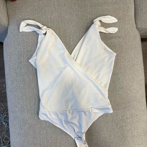 White size large  body suit from dynamite in good condition